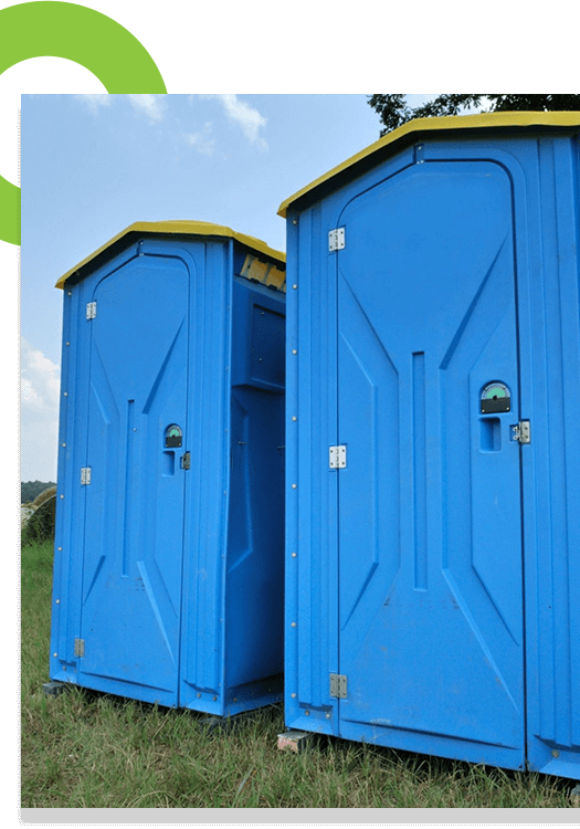 Blue plastic toilets in the summer park